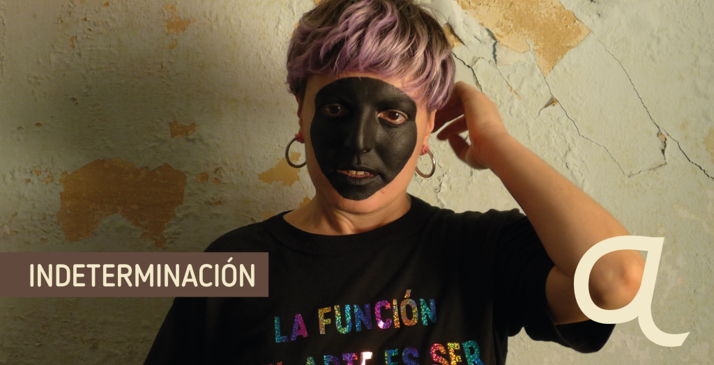 Portada indeterminación. Persona con cara pintada de negro como máscara